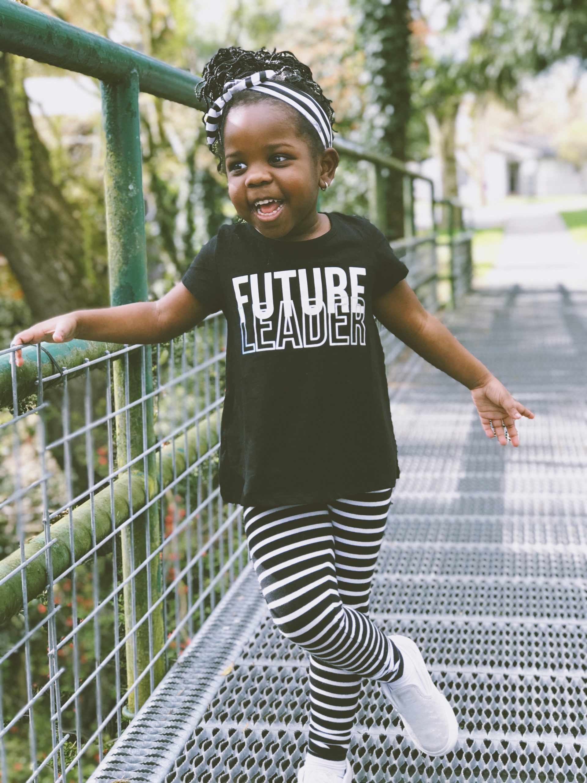 toddler on a bridget wearing a future leader shirt