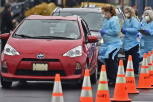 People lined up in cars to get tested for COVID