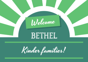 Green and white sign that says Welcome Bethel Kinder Families!