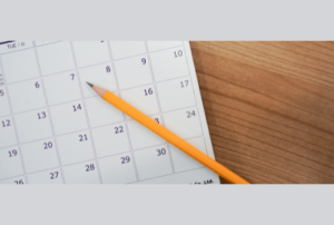 Calendar with pencil laying on it