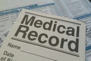 piece of paper with the words "Medical Record" all in capital letters