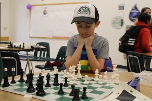 A Prairie Mountain student plays chess. 